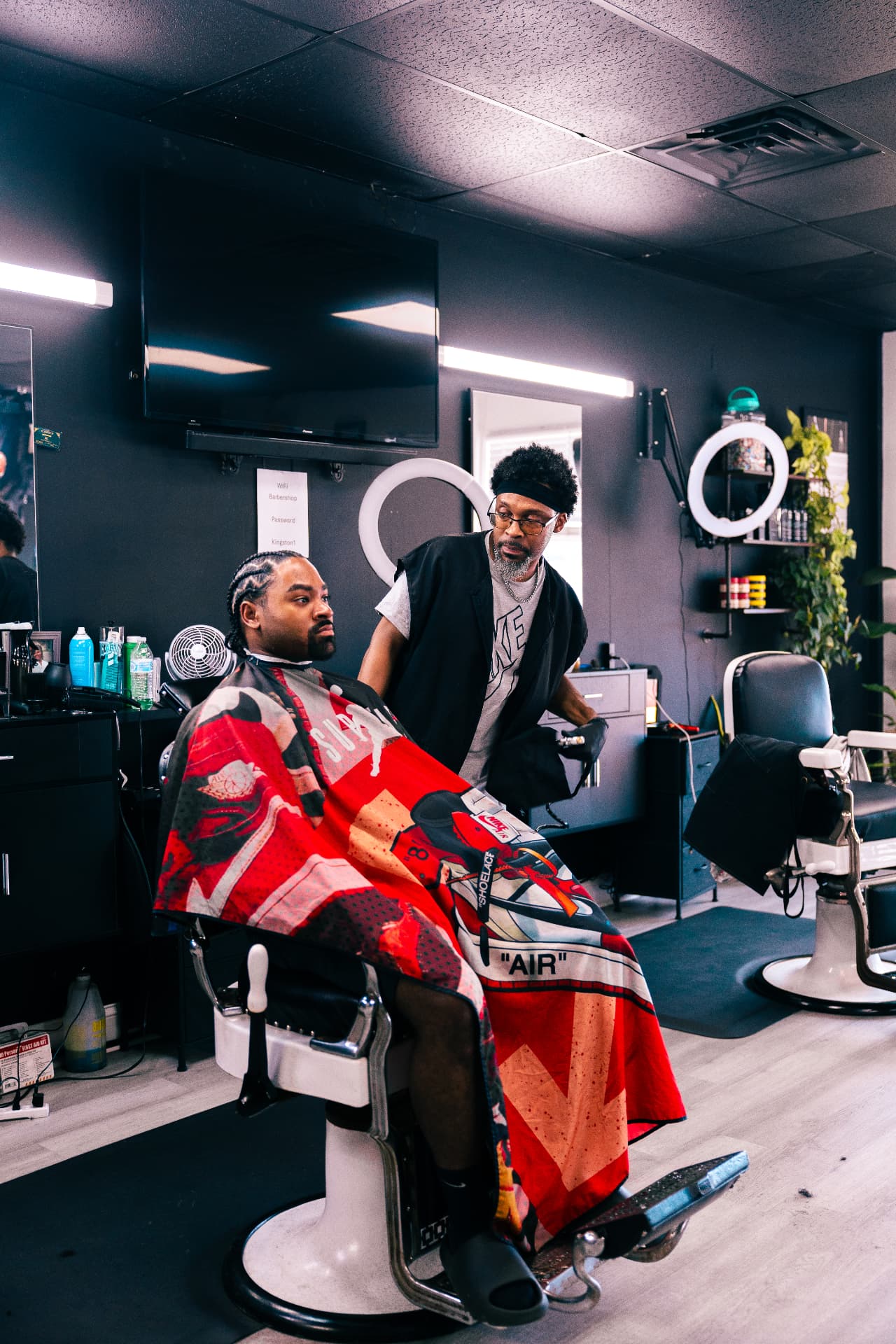 Client in the barber chair talking with his barber at Verified Cuts 2 in Fort Mill, SC.