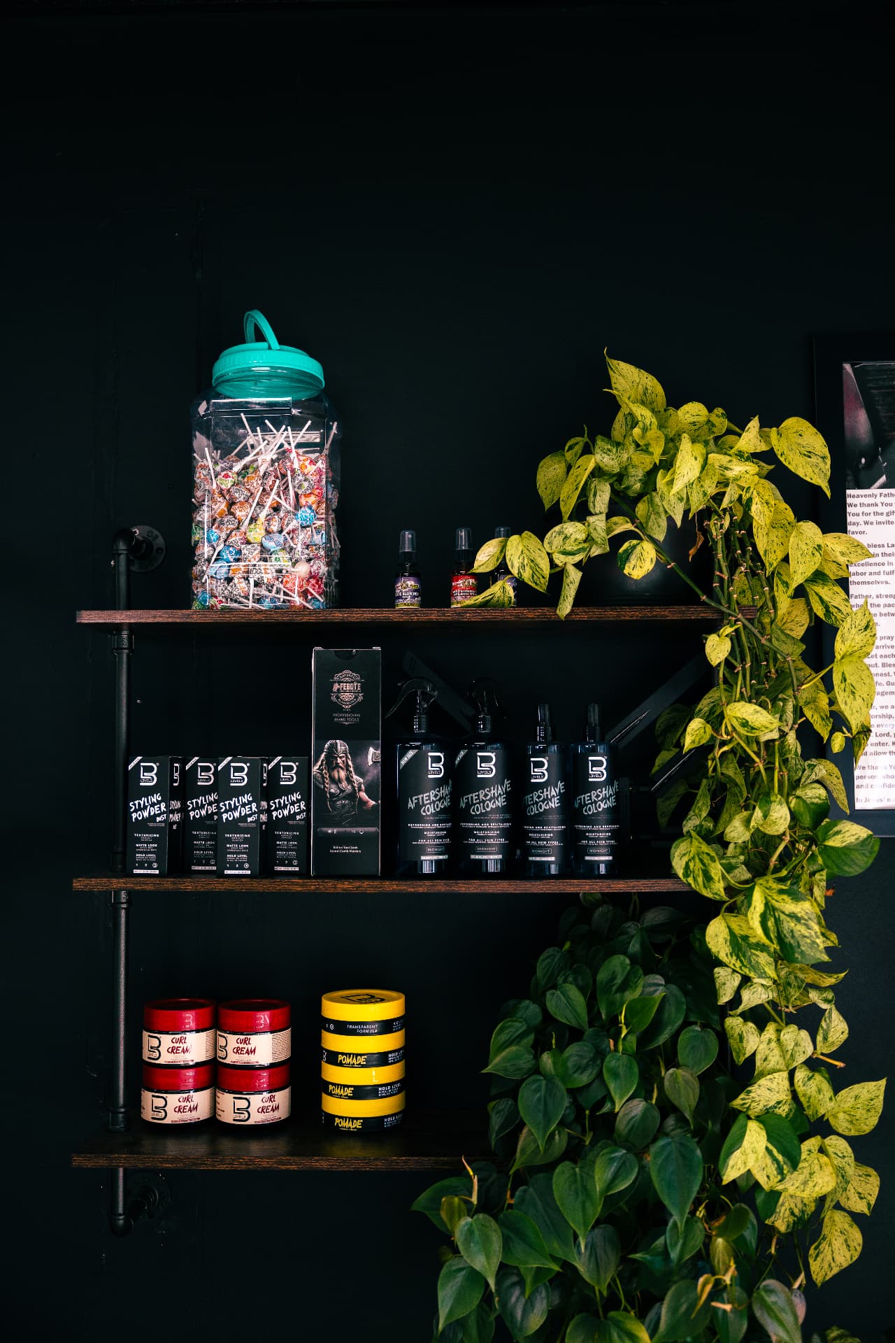 Shelves of grooming products, pomade and aftershave for sale at Verified Cuts 2.